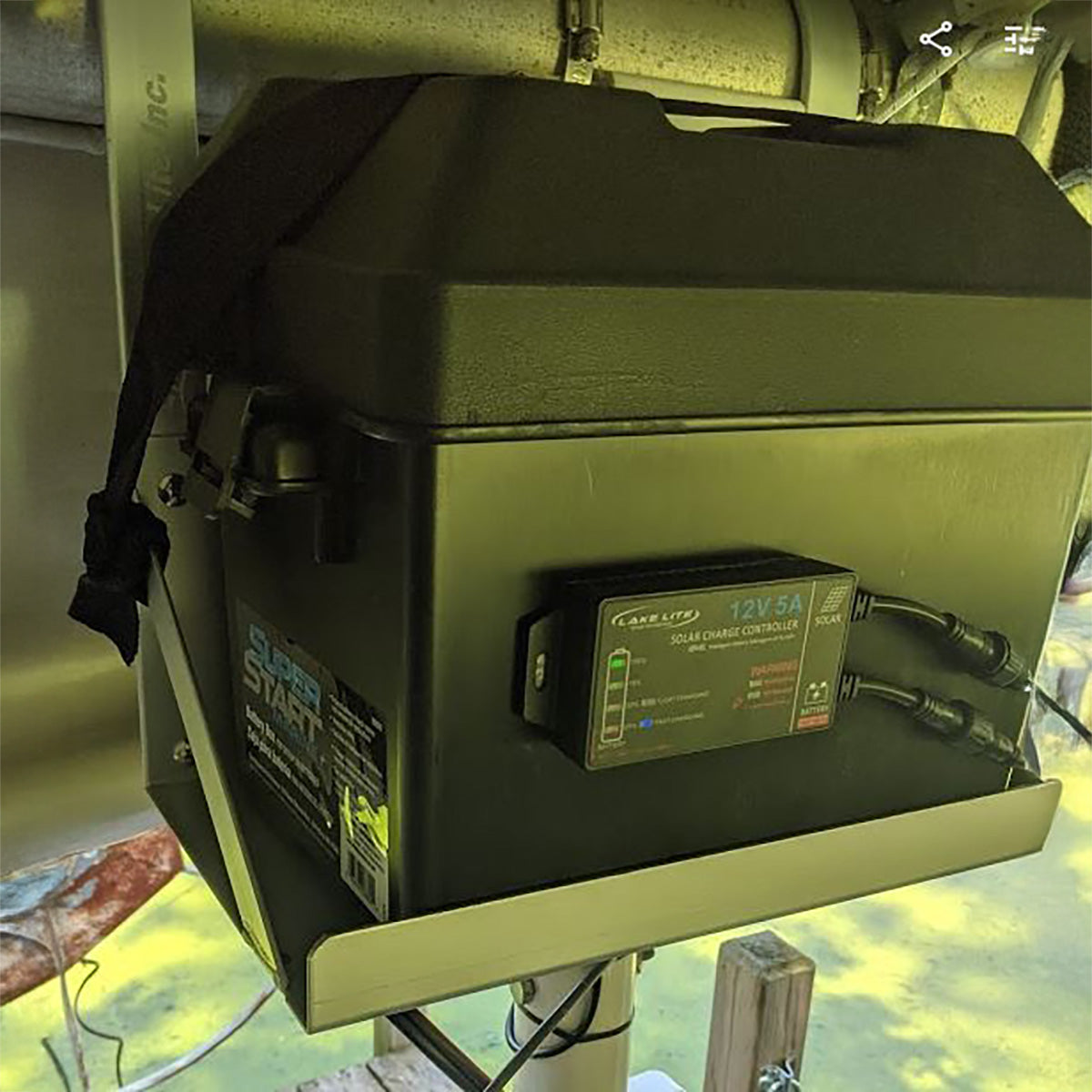 battery box with power controller on a metal surface