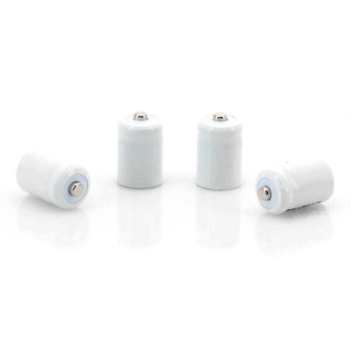 Four cylindrical white batteries on a white background