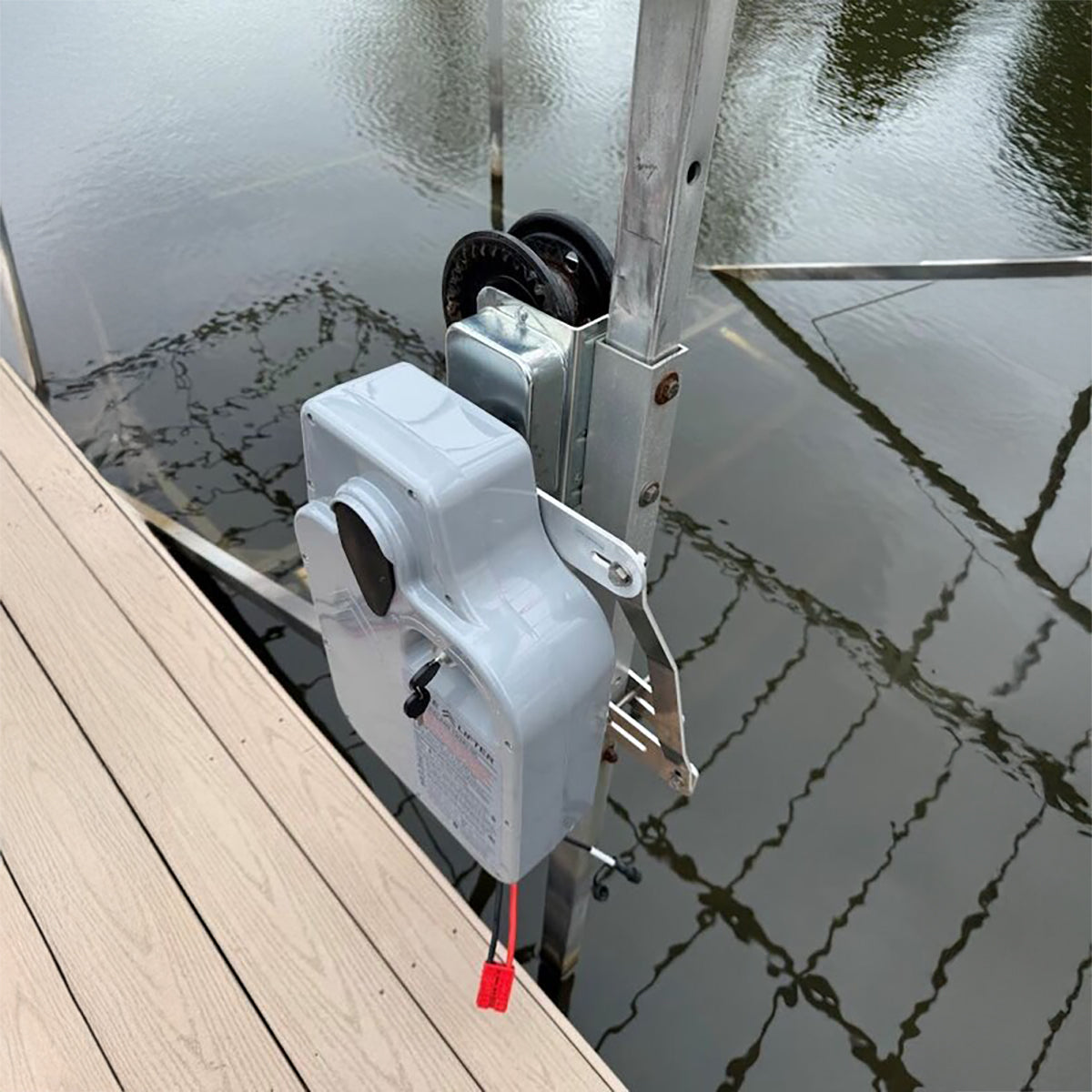 Dock door opener mechanism on a dock with water in the background
