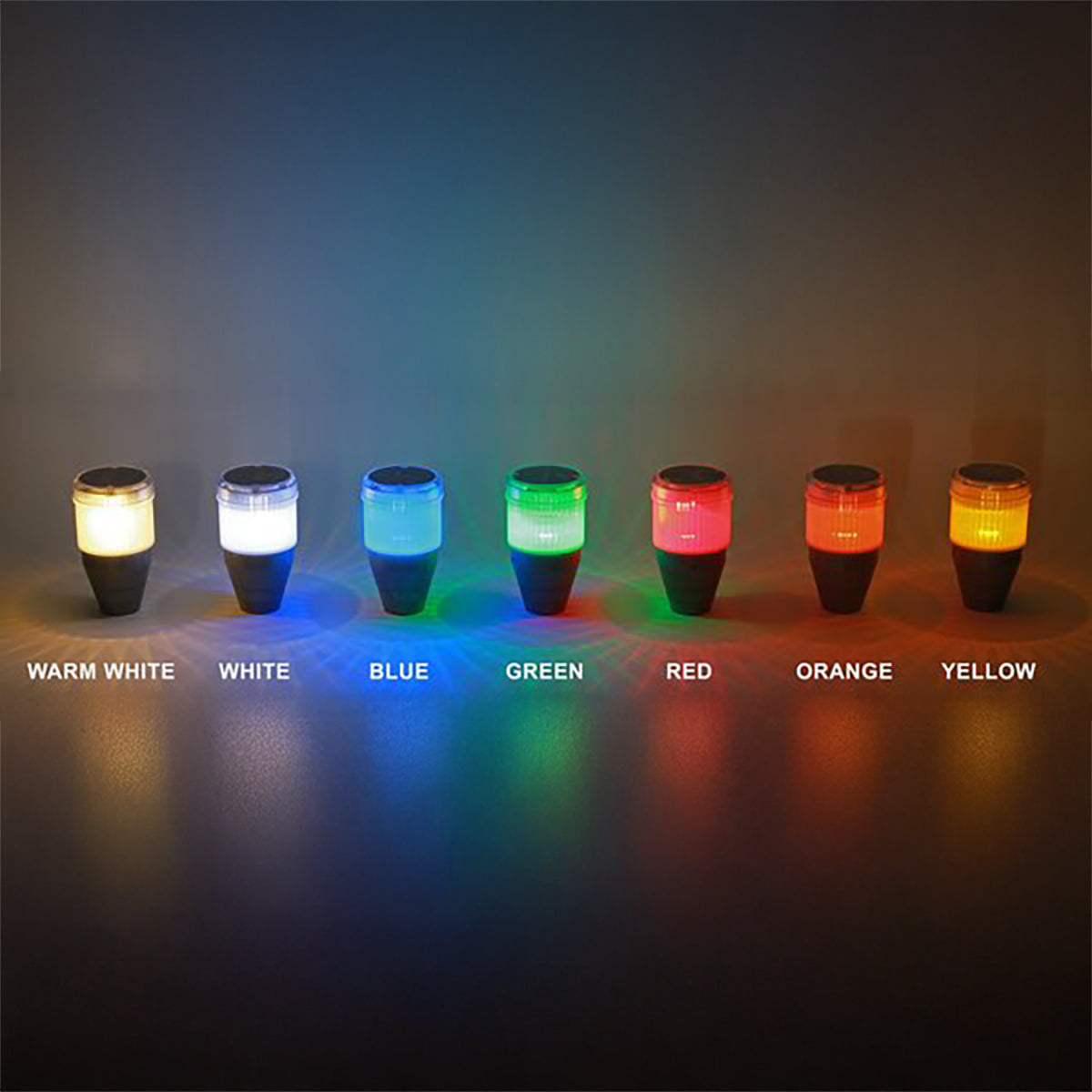 Seven colorful lights emitting different colors on a dark background