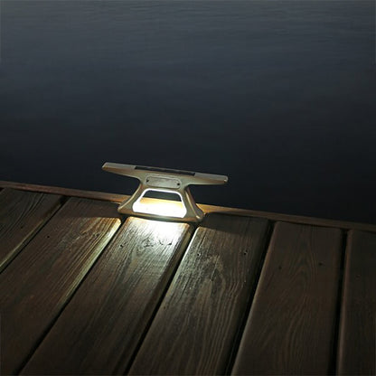 Solar light fixture on a wooden dock at night