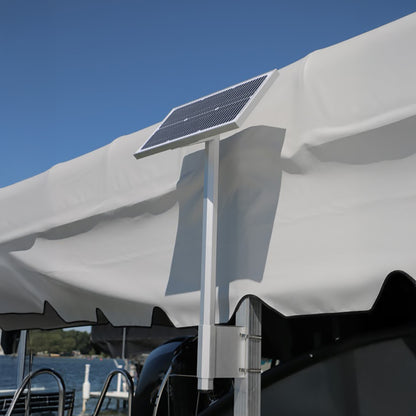 Solar panel on a white canopy with a blue sky background