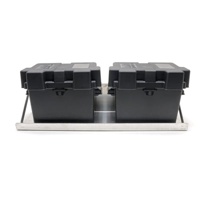 Two black storage boxes on a metal tray with a white background