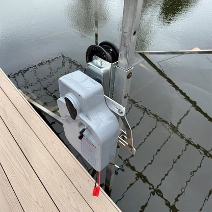 Dock door opener mechanism on a dock with water in the background