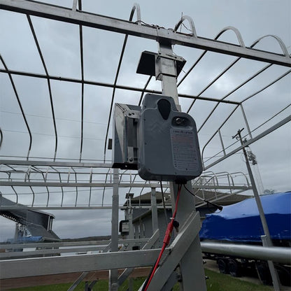 Control panel on a metal structure with a cloudy sky background