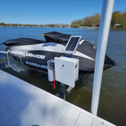Motorboat with solar panel on a dock by a body of water