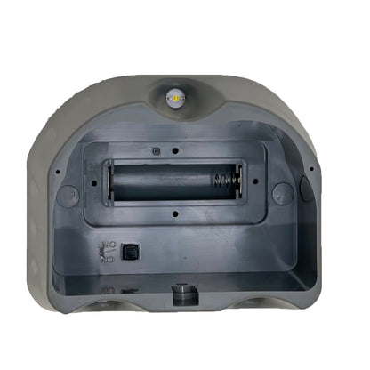 Back view of a gray electronic device on a white background