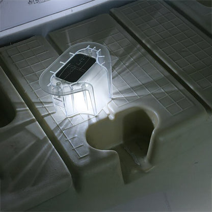 Clear plastic mold on a white surface with grid pattern