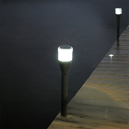Solar-powered garden lights on a wooden deck at night